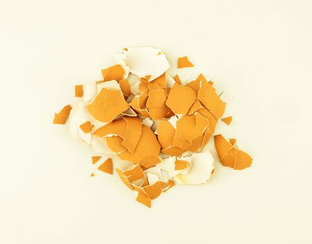 top view of broken egg shell on white background