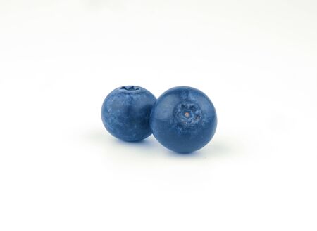 clean two blueberry fruit on white backgroundの写真素材