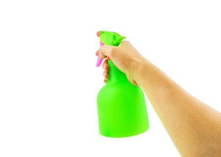 isolated hand holding pump sprayer to washing something