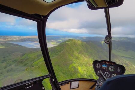Amazing helicopter flight over mountains and lakes on the island of Kauai, Hawaiiの写真素材
