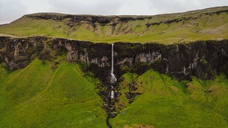 Panoramic landscape Foss a Sidu (Foss Si u) waterfall, Kirkjub jarklaustur, Iceland, Europe. Aerial view shot by drone camera.の写真素材