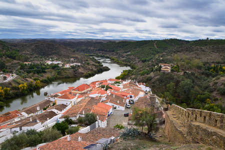 White houses and red rooftops, Mertola town and Guadiana river, Alentejo, Portugal, Europeの写真素材