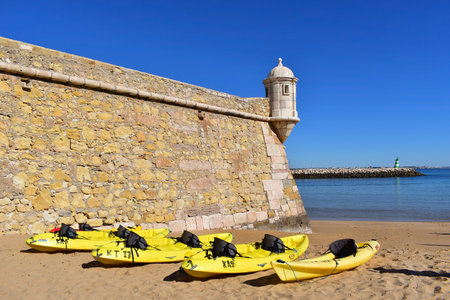 Yellow kayaks on the beach ready for an excursion out on the ocean, Lagos fortress, Algarve, Portugal, Europeのeditorial素材