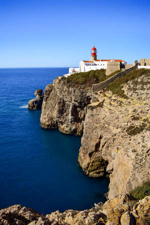 Lighthouse on Cabo de Sao Vicente cliffs, rocky Algarve coastline, Sagres, South Portugal, Europeの写真素材