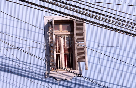 Window and electricity cablesの写真素材