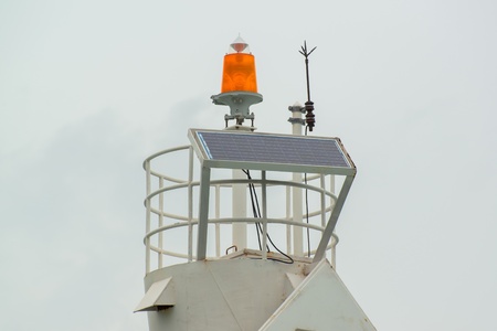 lightning rod and solarcell on the top of lighthouse at the marina , Phuket Thailandの写真素材