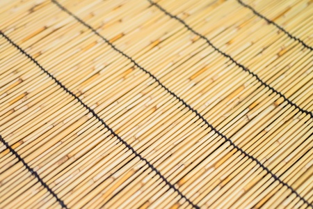 The asian mat from yellow straw  Wood textureの写真素材