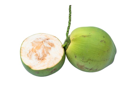Green coconuts over white background の写真素材