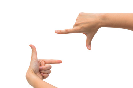 Two woman hand s measuring invisible items  Isolated on whiteの写真素材