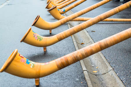 LUCERNE, SWITZERLAND - OCT 27, 2013   A group of musicians lined the streets of Lucerne and play traditional song from  Alphorn  to cheer up the marathon runners on the SWISS CITY MARATHONの写真素材