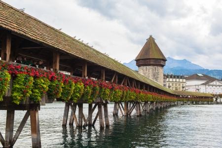 Panoramic view of wooden Chapel bridge and old town of Lucerne, Switzerland のeditorial素材
