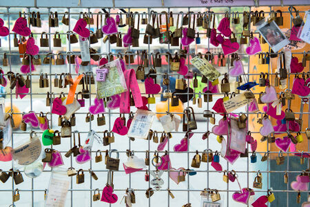 Love locks on a bridge - a widespread habit of putting locks on public bridges