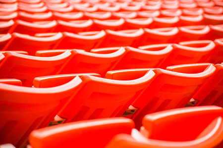 stadium, red seats on stadium steps bleacher の写真素材