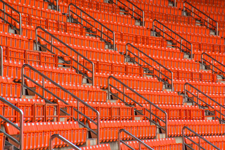 stadium, red seats on stadium steps bleacher の写真素材