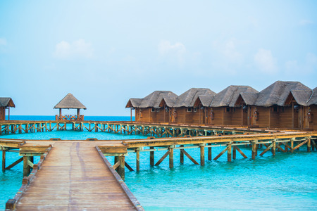 Over water bungalows with steps into amazing green lagoonのeditorial素材