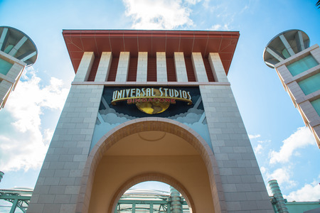 SINGAPORE - JANUARY 13 Tourists and theme park visitors taking pictures of the large rotating globe fountain in front of Universal Studios on January 13, 2015 in Sentosa island, Singaporeのeditorial素材