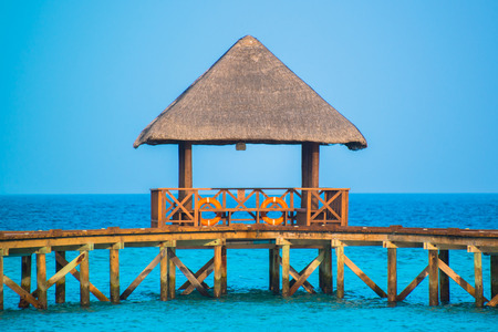Over water bungalows with steps into amazing green lagoonの写真素材
