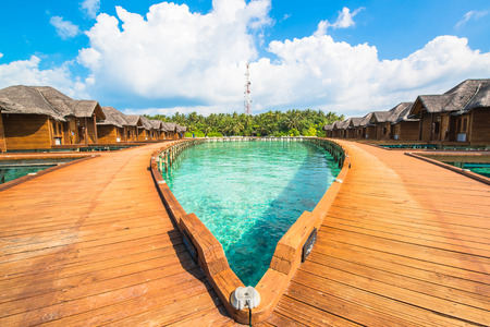 Over water bungalows with steps into amazing green lagoonのeditorial素材