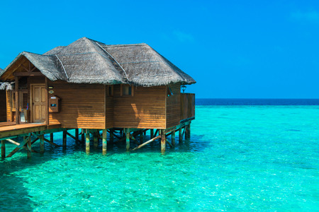 Over water bungalows with steps into amazing green lagoonのeditorial素材