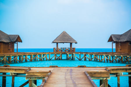 Over water bungalows with steps into amazing green lagoonのeditorial素材