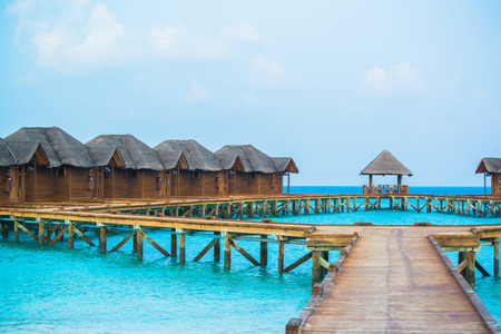 Over water bungalows with steps into amazing green lagoonのeditorial素材
