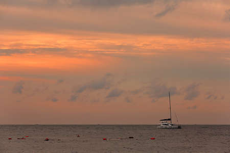 Golden sea waves and sky seen from the westの写真素材
