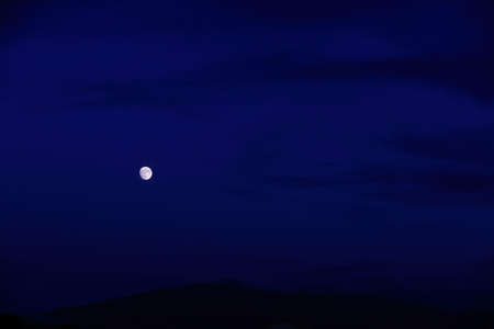 The moon rose alone in the dark nightの写真素材