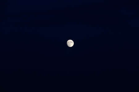 The moon rose alone in the dark nightの写真素材