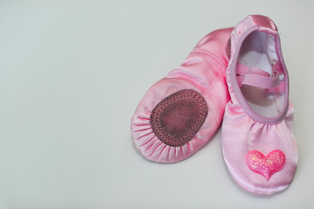 Dirty ballet shoes taken off by a girl who practiced hard at a ballet academyの写真素材