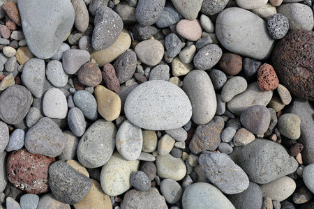 Pebbles naturally polished at Aljakji, a famous Mongdol beach in Jeju Island.の写真素材