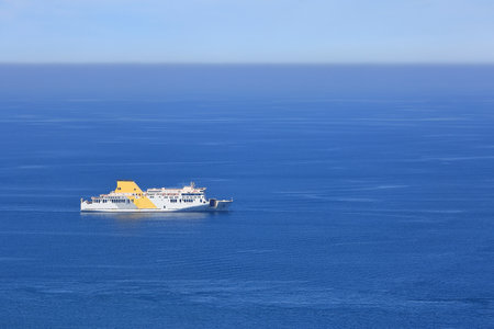 A large passenger ship that leisurely floats on the wide seaの写真素材