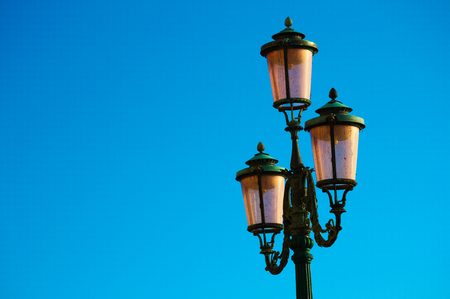 Lantern in front of clear blue sky in Veniceの写真素材