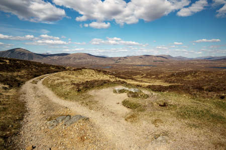 Scottish hiking trail in front of beautiful landscape