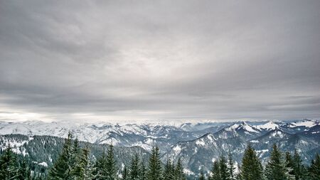 Beautiful view on austrian mountain range and gray skyの写真素材