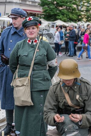 Krakow, Poland - September 23, 2018:  
Men and woman dressed in Polish uniforms from World War I...