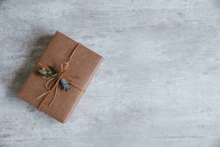 Handmade christmas gift composition on wooden background. Top view, flat lay, copy space. Greeting card.の写真素材