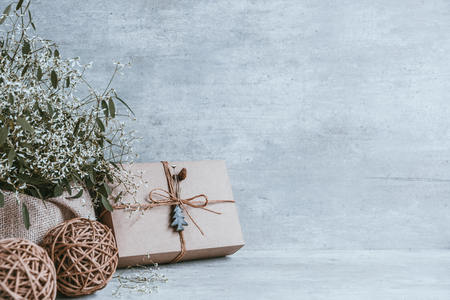 Beautiful and modern christmas gift composition on wooden background. Copy space, greeting card.