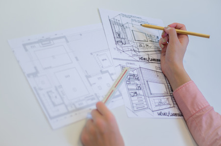 Woman working, projecting on white table, architect, engineer.の写真素材