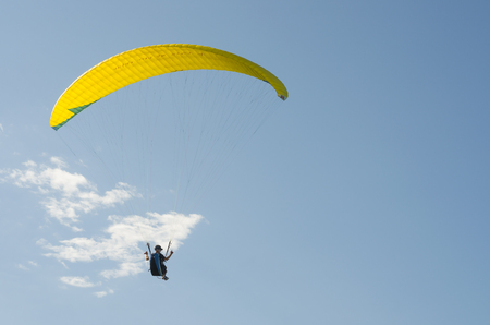 Students practicing paragliding on the hill.の写真素材