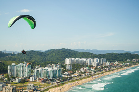 Students practicing paragliding on the hill.の写真素材