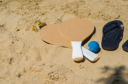 Crab looking at sand beach tennis rackets, caipirinha drinkの写真素材