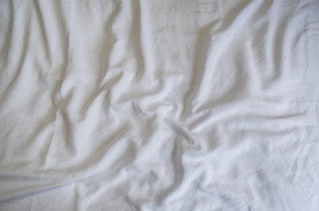 Great concept of bed messy, unkempt, white bed, crumpled sheet.の写真素材