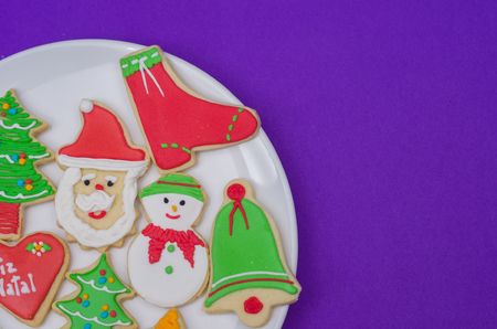 Great christmas background, christmas biscuits on white plate with blue backgroundの写真素材