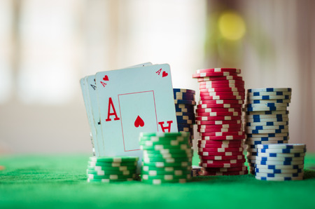 Pair of aces and poker chips, texas hold'em poker.