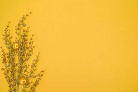 Christmas background with decorative objects and yellow background. With copy space.の写真素材