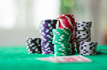 Poker chips stacked on the tableの写真素材