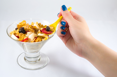 Bowl of granola with fruits, banana, strawberry, raisin.の写真素材