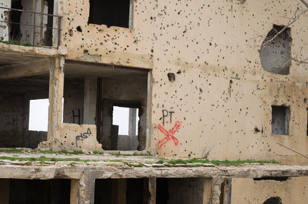 Beqaa, Lebanon, April 04 - 2017: Marks of War, Lebanese house machine-gunned, bombed, destroyed by civil war, conflict zone, Lebanon mountains.のeditorial素材
