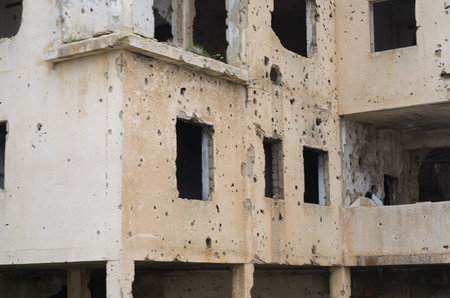 Beqaa, Lebanon, April 04 - 2017: Marks of War, Lebanese house machine-gunned, bombed, destroyed by civil war, conflict zone, Lebanon mountains.のeditorial素材