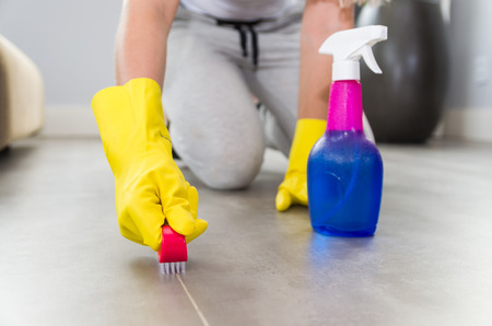 Great concept of domestic cleaning, woman cleaning the floor.